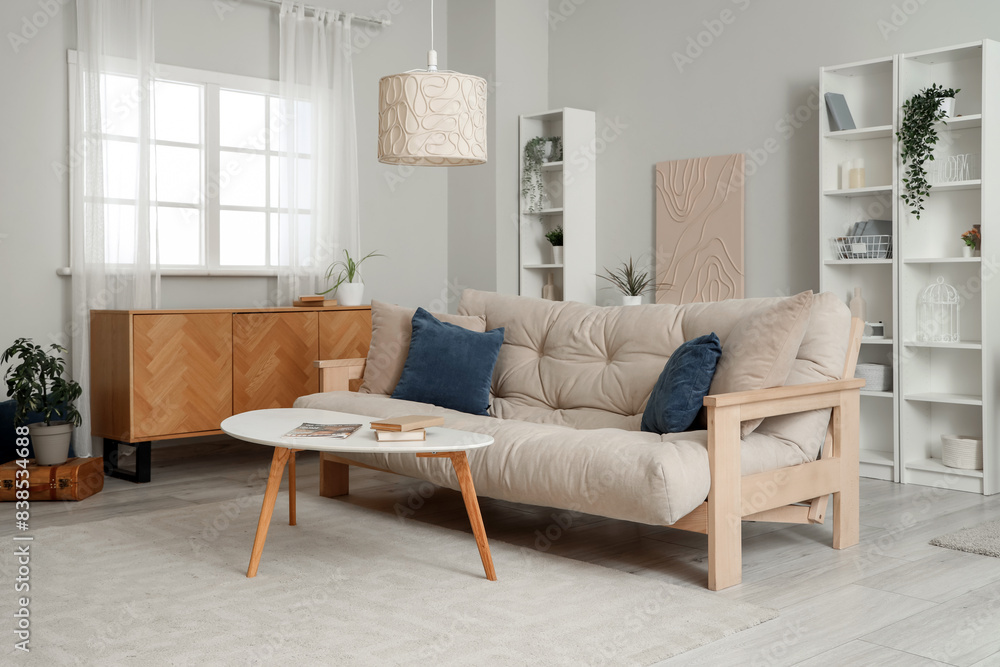 Stylish interior of living room with soft sofa and coffee table Stylish interior of living room with soft sofa and coffee table