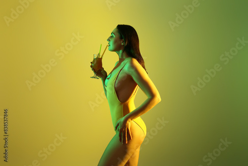Pretty young woman in swims...