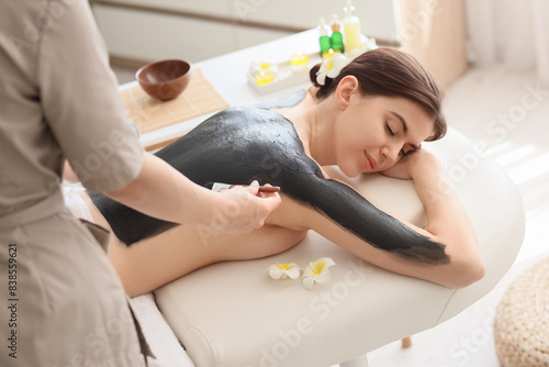 Massage therapist applying ...