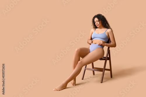 Young woman in blue underwe...