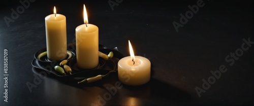 Burning candles on dark background