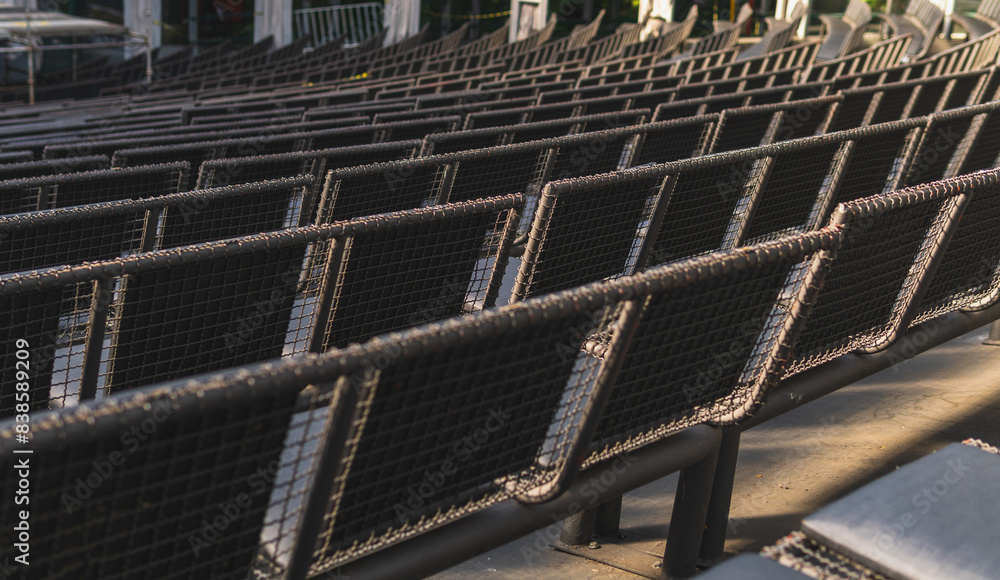 Empty seats in a concert hall, theater. Black chairs in modern style Empty seats in a concert hall, theater. Black chairs in modern style