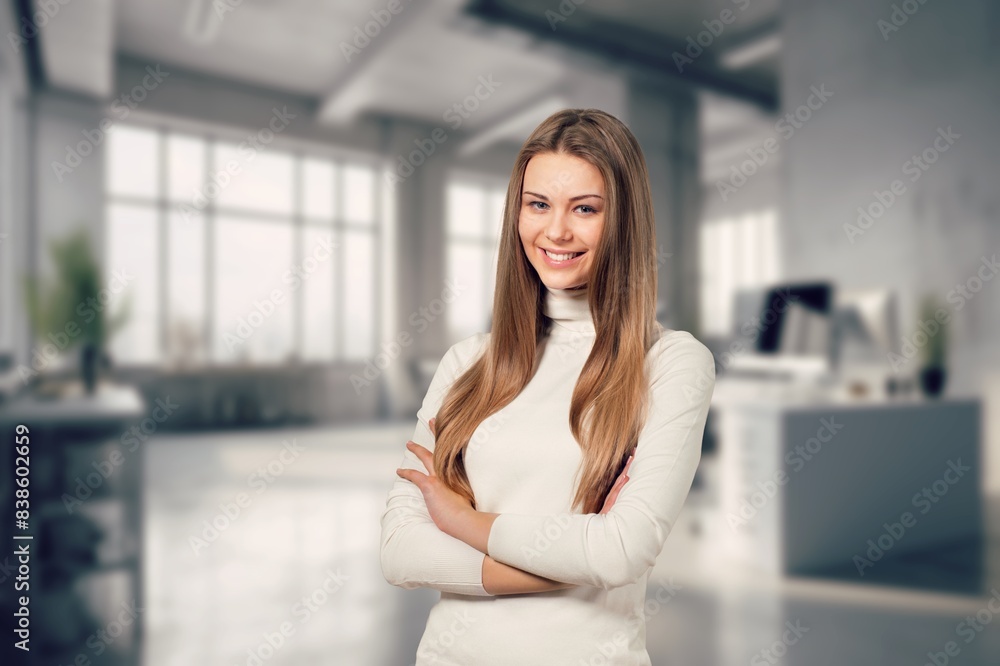 A bright and cheerful business woman in office A bright and cheerful business woman in office