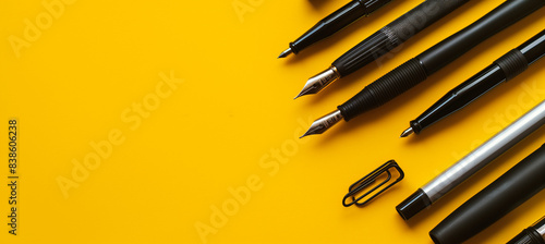 Writing instruments on yellow background