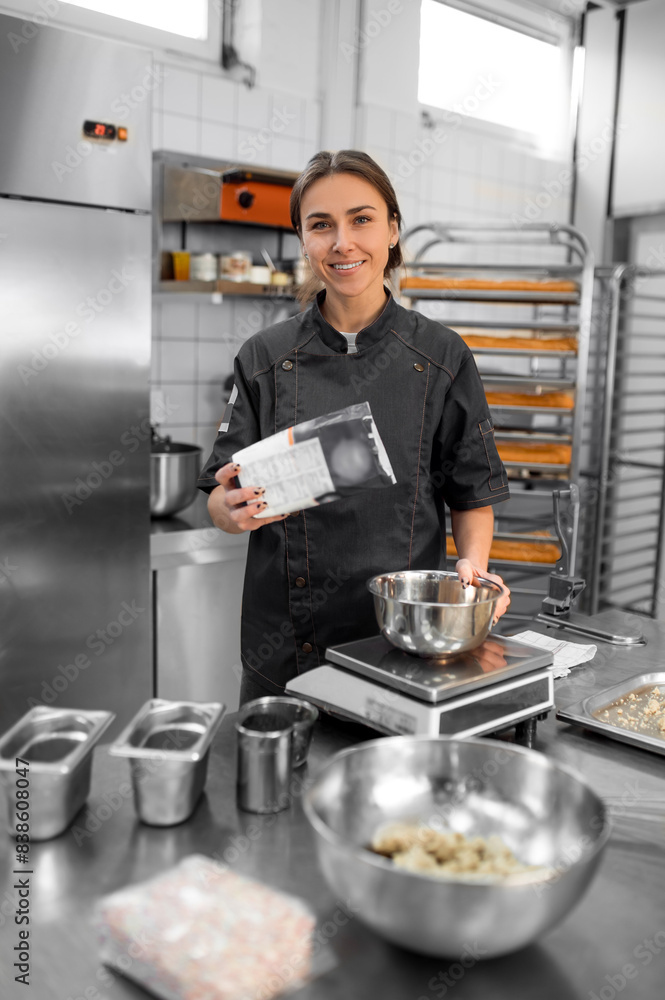 Experienced chef in professional kitchen preparing dough with flour to make bread Experienced chef in professional kitchen preparing dough with flour to make bread