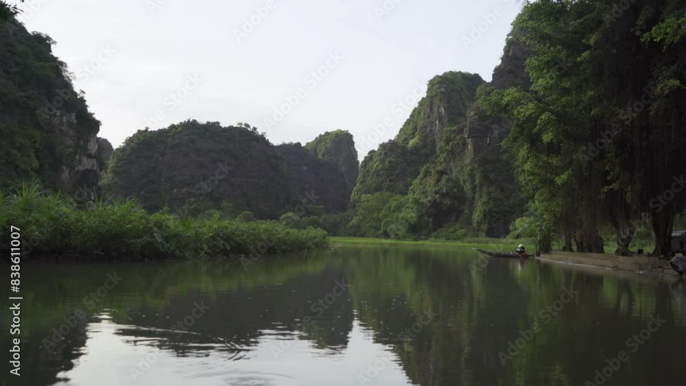 Nin Binh. Sailing boats with lake or river in travel and environment concept. Nature landscape background in Vietnam. Nin Binh. Sailing boats with lake or river in travel and environment concept. Nature landscape background in Vietnam.