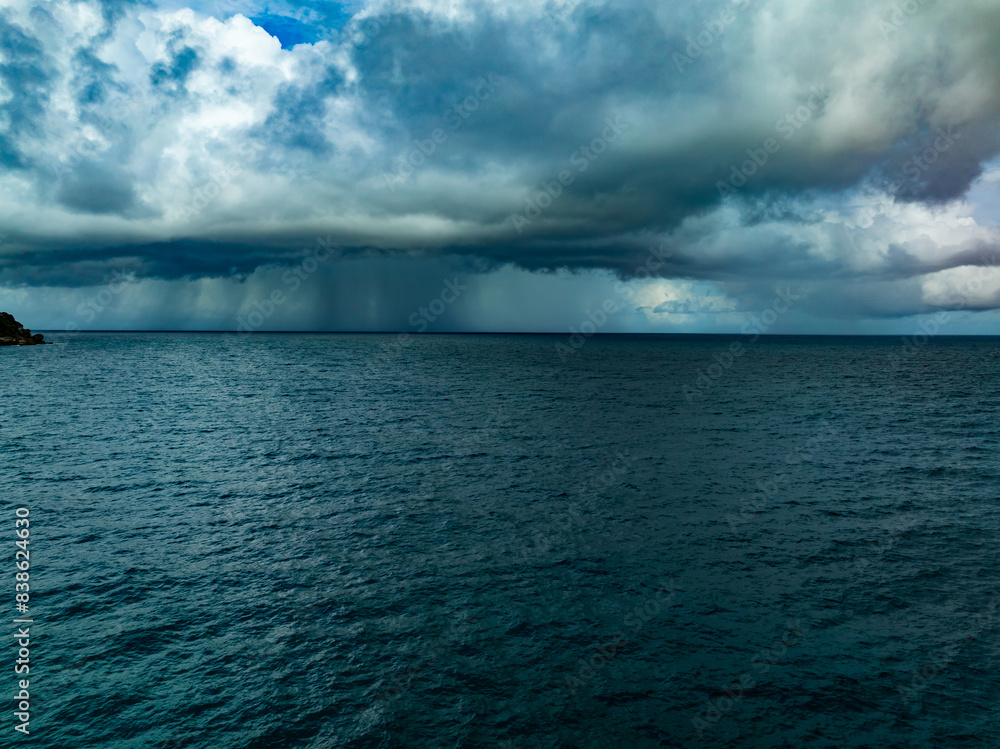 Fototapeta premium Aerial view of Storm clouds over sea,Sea surface ocean waves background