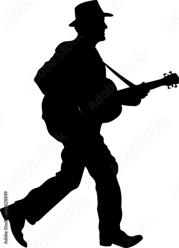 Silhouette of a Man Walking with a Guitar