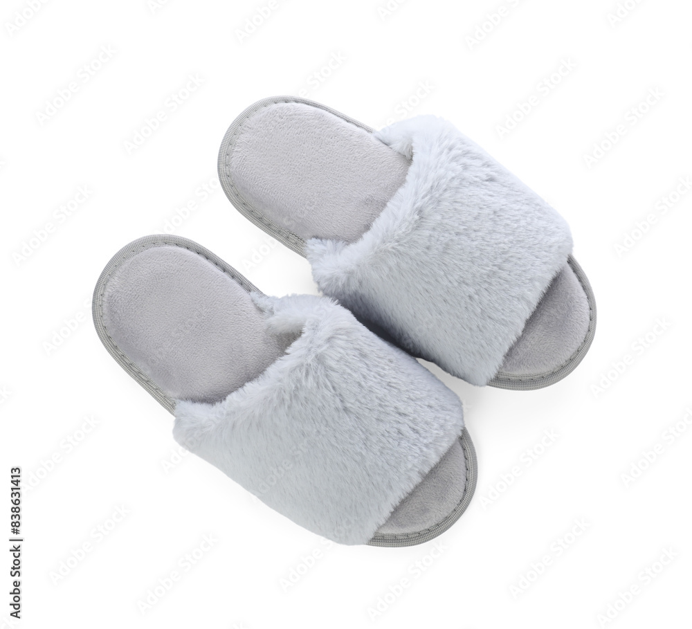 Pair of soft slippers with fur isolated on white, top view Pair of soft slippers with fur isolated on white, top view