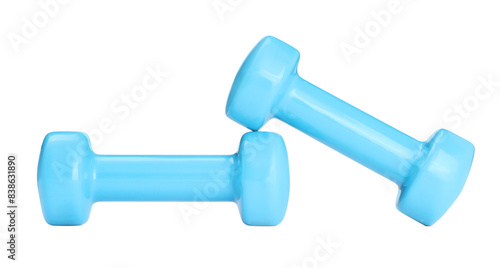 Light blue dumbbells isolated on white. Sports equipment