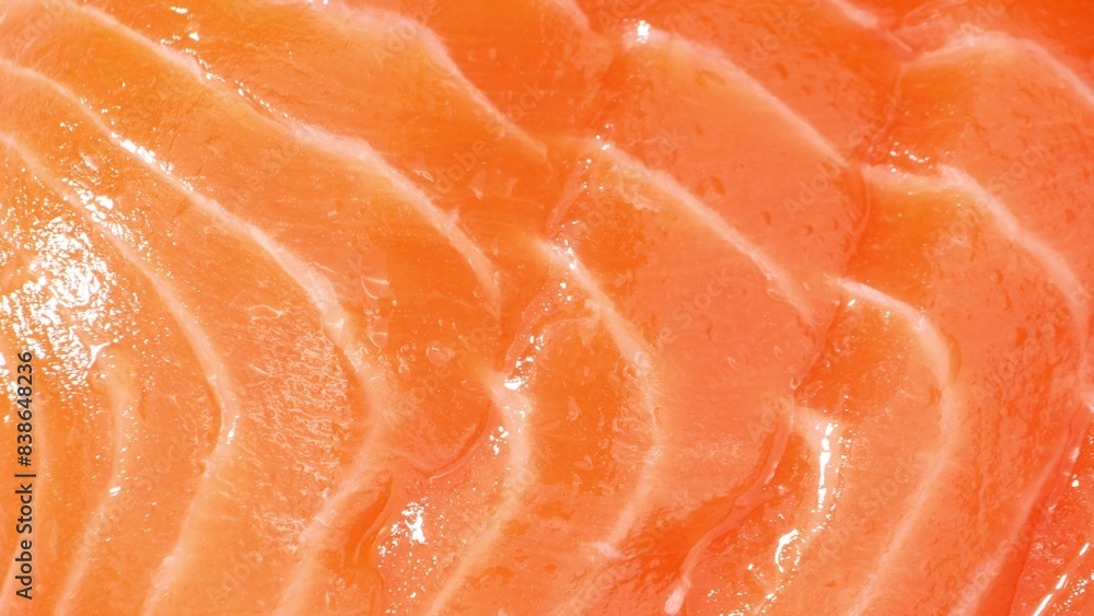 Dive into the salmon's world: Velvety strands of muscle interlace with pockets of rich adipose tissue, bathed in a vibrant orange hue of astaxanthin. Its lustrous surface mirrors the freshness within. Dive into the salmon's world: Velvety strands of muscle interlace with pockets of rich adipose tissue, bathed in a vibrant orange hue of astaxanthin. Its lustrous surface mirrors the freshness within.