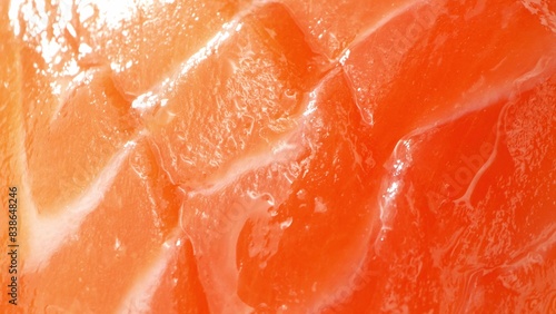Experience the allure of sashimi-grade salmon: a symphony of vibrant orange tones and translucent layers. Each slice, meticulously cut, embodies the pinnacle of freshness and culinary craftsmanship. 