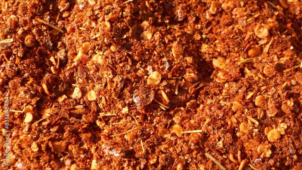 Close-up of ground chili: a fiery tapestry of crushed flakes and seeds, their coarse texture a testament to their potency. Rich red and orange hues dance, promising a burst of flavor and heat.
Close-up of ground chili: a fiery tapestry of crushed flakes and seeds, their coarse texture a testament to their potency. Rich red and orange hues dance, promising a burst of flavor and heat.