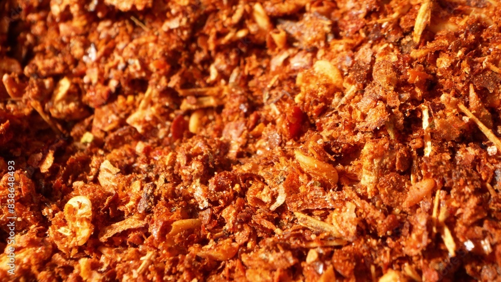 A close-up unveils a dynamic blend of red chili flakes and seeds, finely ground yet coarse in texture. With its myriad of flakes and seeds, it teases a potent, fiery taste experience.
A close-up unveils a dynamic blend of red chili flakes and seeds, finely ground yet coarse in texture. With its myriad of flakes and seeds, it teases a potent, fiery taste experience.