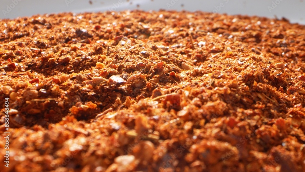 At a close glance, ground chili unveils its intricate makeup: a mosaic of coarse flakes, scattered seeds, and powdery dust, radiating an intense red-orange hue, a testament to its potent spiciness.
At a close glance, ground chili unveils its intricate makeup: a mosaic of coarse flakes, scattered seeds, and powdery dust, radiating an intense red-orange hue, a testament to its potent spiciness.