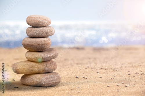 Balanced rock on sea beach at sunny day