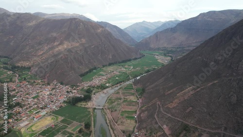 Aerial drone view of the beautiful and lush Valle Sagrado (Sacred Valley) in the Andes Mountains in Peru towards Ollantaytambo