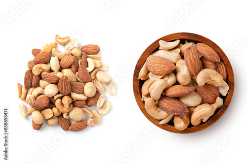 Mixed nuts with nuts in wooden bowl isolated on white. Top view