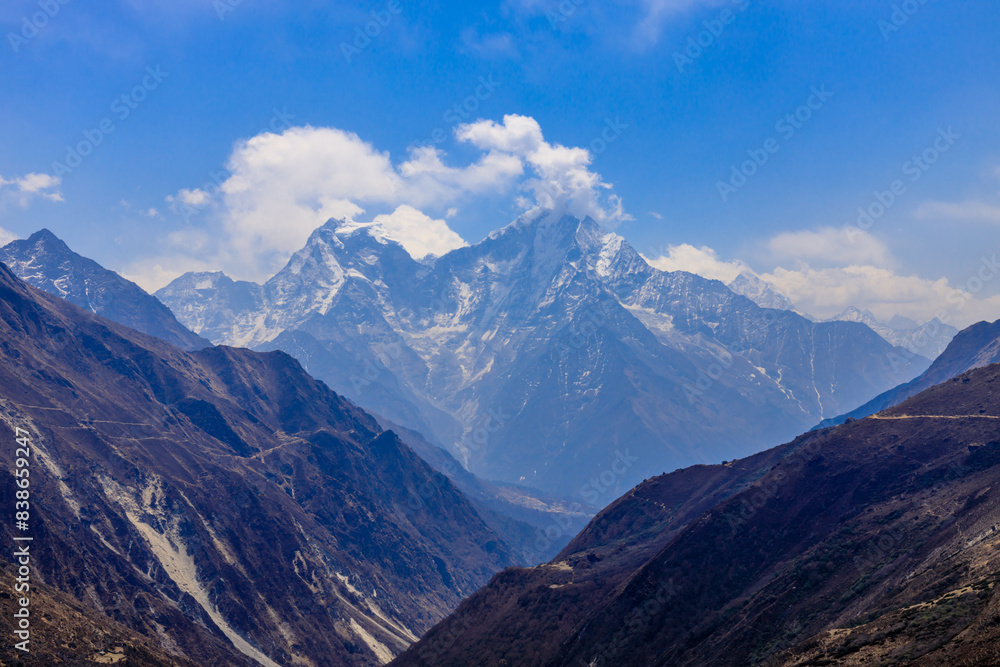 Himalaya mountains landscape with high altitude snow and ice glacier summit peaks. Everest Base Camp Solo Khumbu trekking region in Nepal. Beautiful Himalayas eight thouthander summits under blue sky Himalaya mountains landscape with high altitude snow and ice glacier summit peaks. Everest Base Camp Solo Khumbu trekking region in Nepal. Beautiful Himalayas eight thouthander summits under blue sky