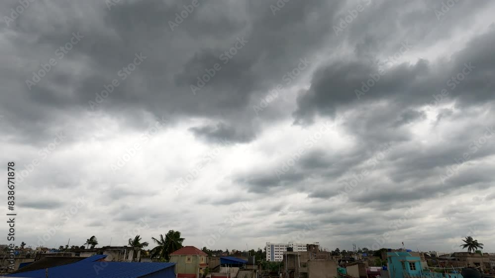 dark rain clouds moving during cyclone storm over urban cities in monsoon or rainy season. The effect of climate change due to global warming. dark rain clouds moving during cyclone storm over urban cities in monsoon or rainy season. The effect of climate change due to global warming.