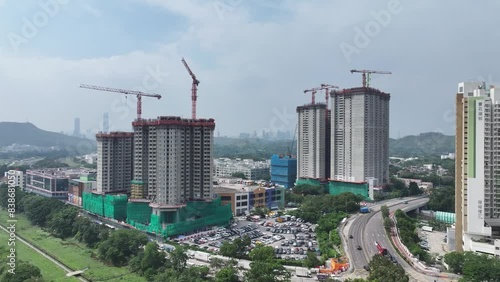 Witness the construction of high-rise public housing estates in Fanling and Sheung Shui, addressing Hong Kong's housing needs through redevelopment photo