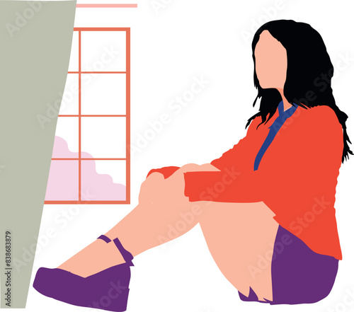 A girl is sitting on floor.