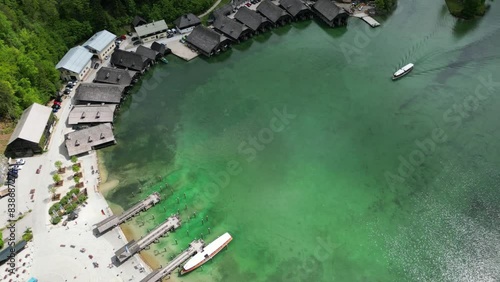 Aerial view of electric tourist boat arriving to the small harbor at Schönau on picturesque lake Königssee near the town of Berchtesgaden in the Bavarian Alps in Germany photo