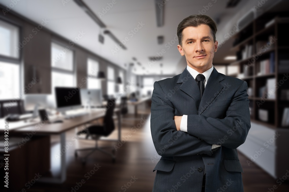 Happy young businessman leader standing in office. Happy young businessman leader standing in office.