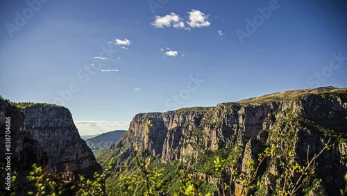 High angle shot of Vikos Gorge, a gorge in the Pindus Mountains of northern Greece, lying on the southern slopes of Mount Tymfi in Zagori region, Greece at daytime.                                                                                            photo