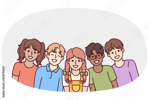 Happy diverse children students in junior school smiling rejoicing at opportunity to communicate with friends. Children teenagers of different races and nationalities laugh enjoying communication