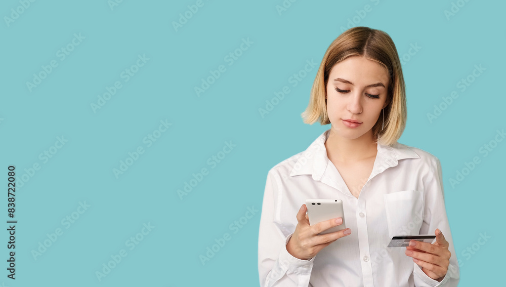 Digital banking. Mobile app. Secure transaction. Verification process. Focused woman typing personal information isolated on blue empty space. Digital banking. Mobile app. Secure transaction. Verification process. Focused woman typing personal information isolated on blue empty space.