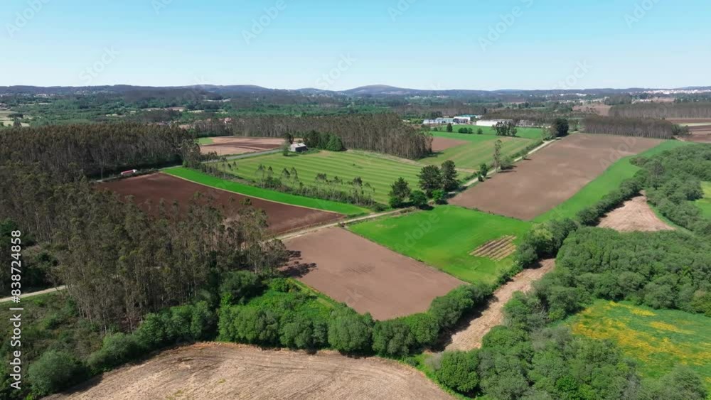 Vista Of Farmlands During Sunny Day Near Countryside Town. Aerial Drone Shot Vista Of Farmlands During Sunny Day Near Countryside Town. Aerial Drone Shot