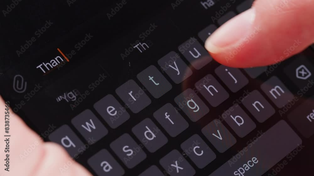 Young woman is typing a message at smartphone close-up macro. Communicating and chatting with mobile phone. Young woman is typing a message at smartphone close-up macro. Communicating and chatting with mobile phone.