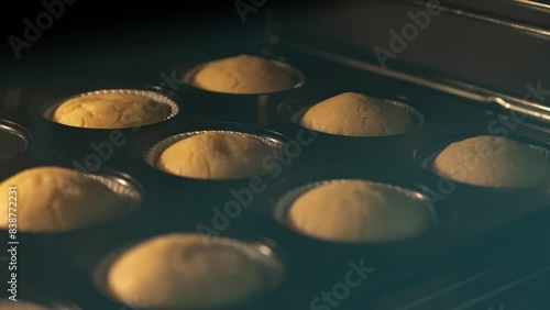 Timelapse of cupcake muffins rise while baking in oven