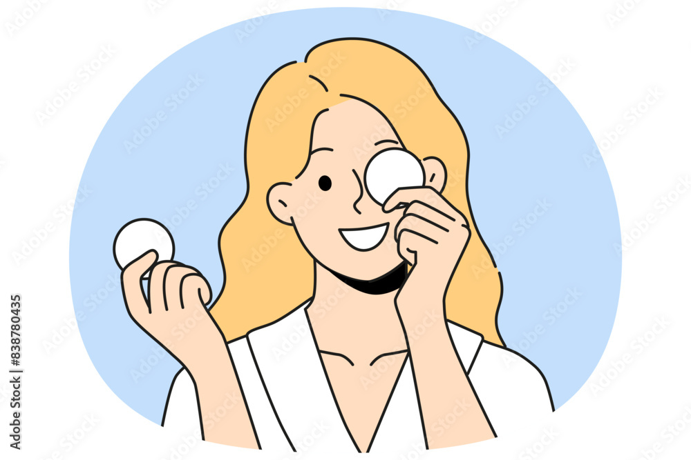 Woman with cotton pads for removing makeup and mascara with lipstick smiling getting ready for bed. Beautiful girl uses cotton pads for cosmetic purposes, wanting to impress boyfriend Woman with cotton pads for removing makeup and mascara with lipstick smiling getting ready for bed. Beautiful girl uses cotton pads for cosmetic purposes, wanting to impress boyfriend