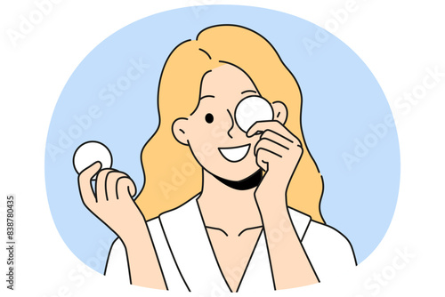Woman with cotton pads for removing makeup and mascara with lipstick smiling getting ready for bed. Beautiful girl uses cotton pads for cosmetic purposes, wanting to impress boyfriend
