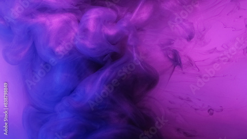 Neon smoke whirl. Paint water mix. Defocused fluorescent pink blue purple color gradient glowing glitter texture vapor vortex abstract art background.