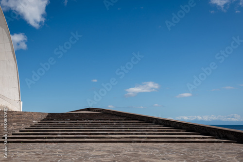 Stair leading to a building with the blue sky in the background