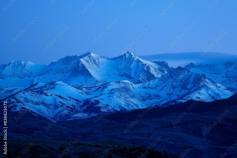 Fototapeta premium Snow-Covered Mountain Range at Twilight