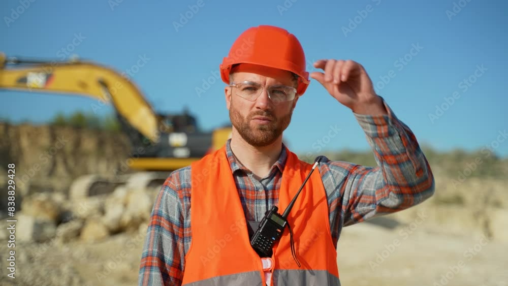 Portrait of builder in uniform at construction site Portrait of builder in uniform at construction site