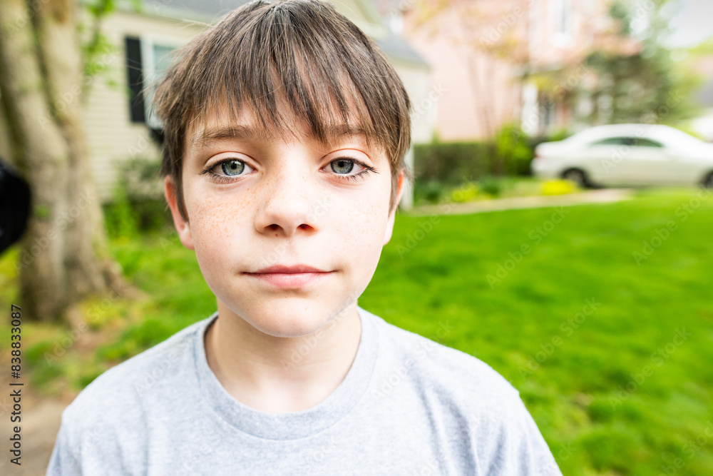 Portrait of a boy in yard