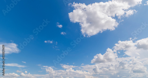 clear blue sky background clouds with background  Blue sky background with tiny clouds. White fluffy clouds in the blue sky.  Captivating stock photo featuring the mesmerizing beauty of the sky and cl