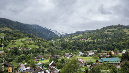 Mountain village in Carpathians after the rain with steaming slopes