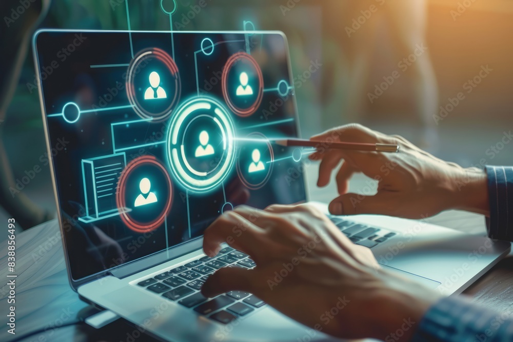 A business person uses a laptop to create target audience ICONS,Digital marketing online, CRM, Data exchanges development and customer service. A business person uses a laptop to create target audience ICONS,Digital marketing online, CRM, Data exchanges development and customer service.