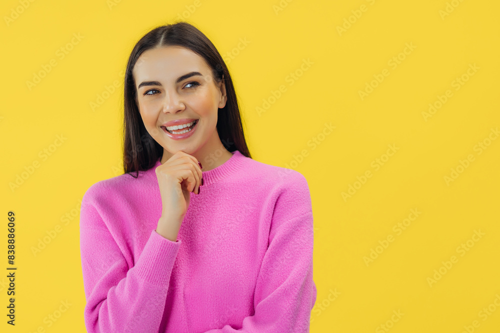 Fototapeta premium Pensive minded woman touch hand chin think thoughts isolated over yellow color background