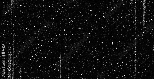 Vintage patern subtle white grunge speckle on black background. Distress grain abstract texture with grungy splash dirty pattern. Backdrop with specks, grit, scratches, rough sand effect  
