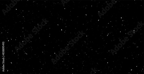 Seamless patern subtle white grunge speckle on black background. Distress grain abstract texture with grungy splash dirty repeated pattern. Backdrop with specks, grit, scratches, rough sand effect  