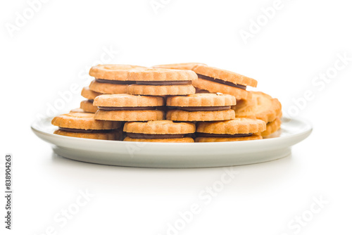 Wallpaper Mural Sandwich Cookies with a cream filling on plate isolated on white background. Torontodigital.ca
