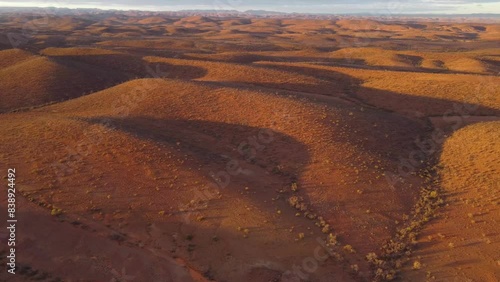 Drone shot of the rolling hills in the Flinders Ranges, Australia at sunrise. Shot in 4K photo