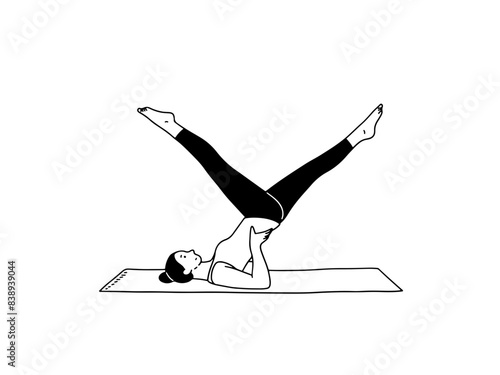 Young woman doing pilates exercises